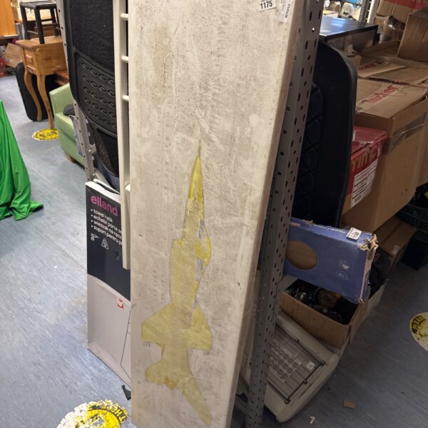 Large acrylic display board with a fighter jet sticker.