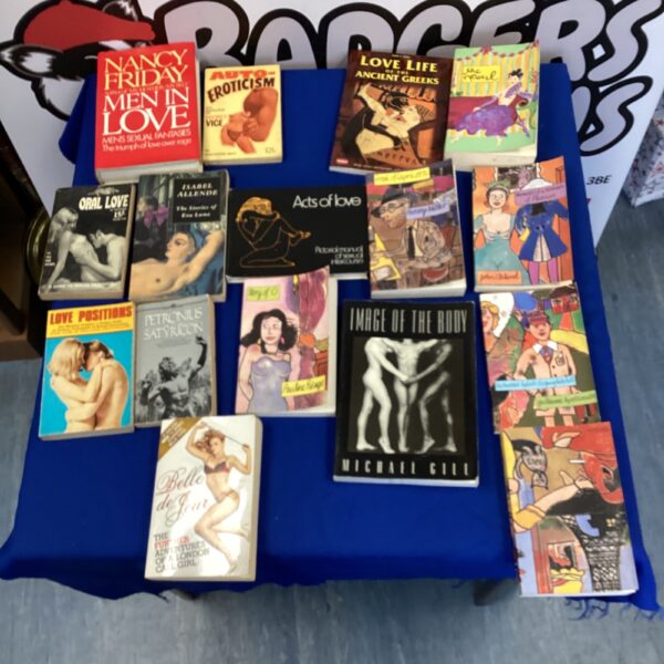 Vintage adult literature collection with various erotic books.