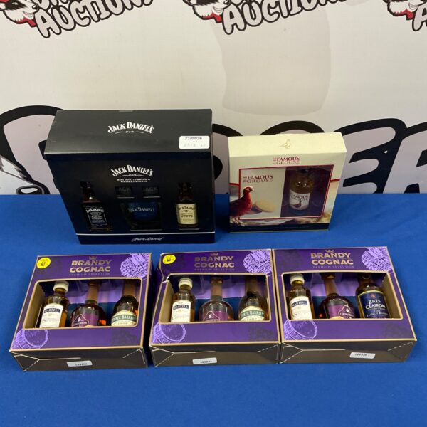 Collection of alcohol gift sets including brandy, cognac, and Jack Daniel’s.