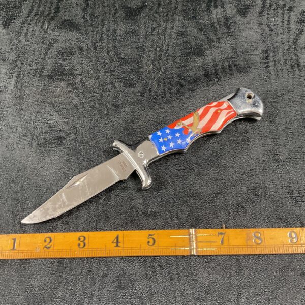 Vintage American eagle pocket knife with detailed handle.