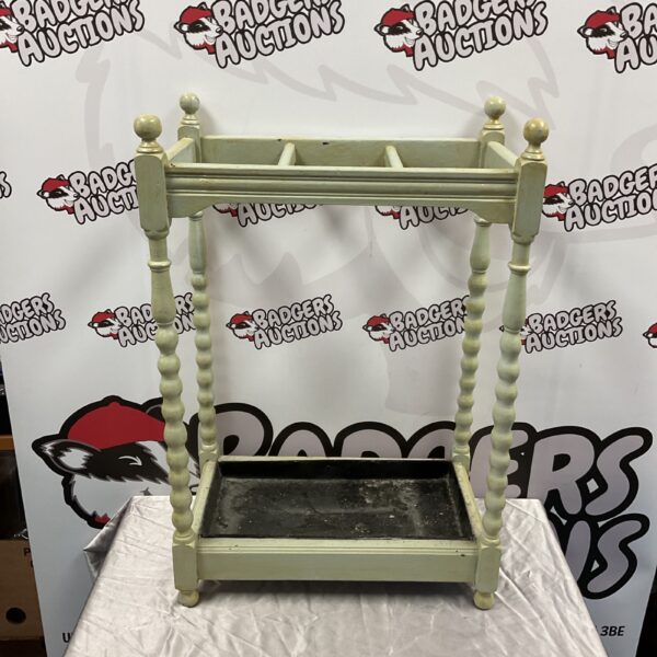 Antique barley twist stick stand with decorative design.