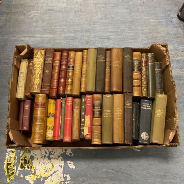 Antique book collection featuring leather bound volumes and classic literature.