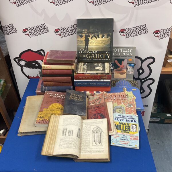 Antique book collection featuring gothic architecture volume.