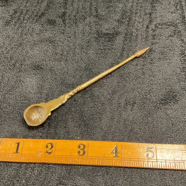 Antique brass anointing spoon circa 1900, religious artifact.