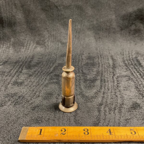 Antique brass bullet oiler from around 1920, a collectible vintage tool.