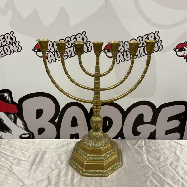 Antique brass menorah candelabra with multiple arms.