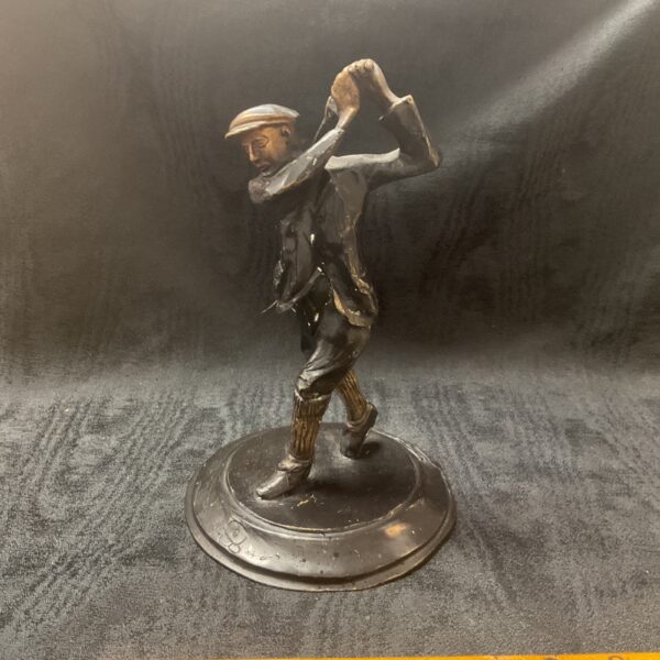 Antique bronze golfer figurine from the 1920s, detailed sculpture.
