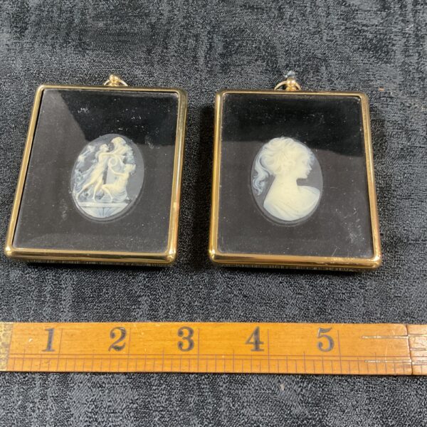 Antique pair of framed cameo pictures with classical profiles.