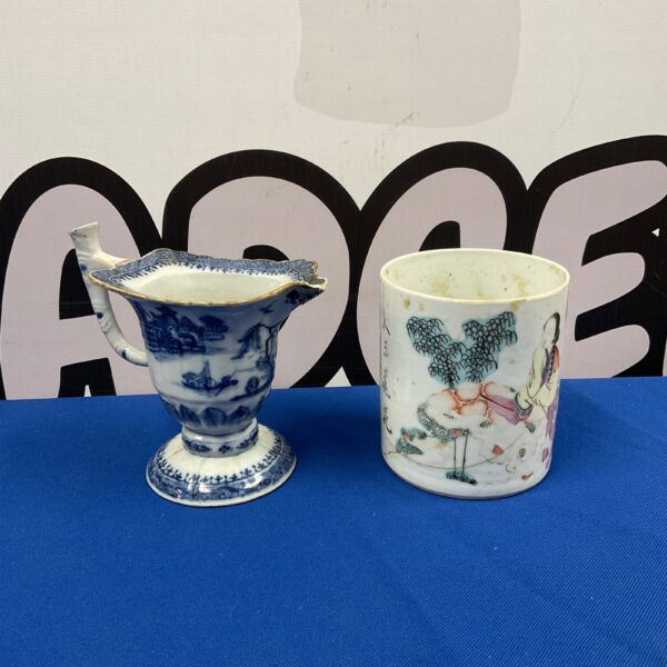 Antique Chinese blue and white porcelain jug with landscape design.
