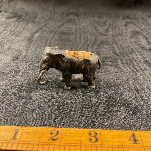 Antique cold painted elephant pincushion, vintage sewing accessory.