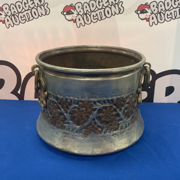 Antique copper cauldron with Art Nouveau floral detailing.