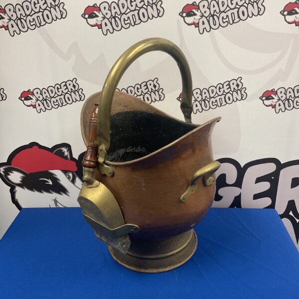 Antique copper coal scuttle with brass handle and shovel.