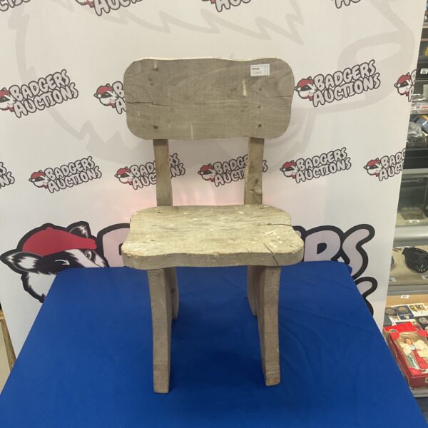 Antique elm child’s chair with rustic charm.