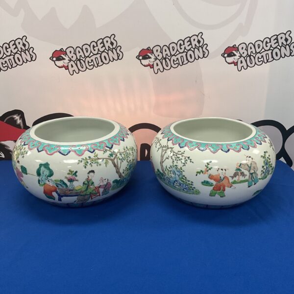 Antique Chinese Famile Rose porcelain fish bowls with detailed floral designs.