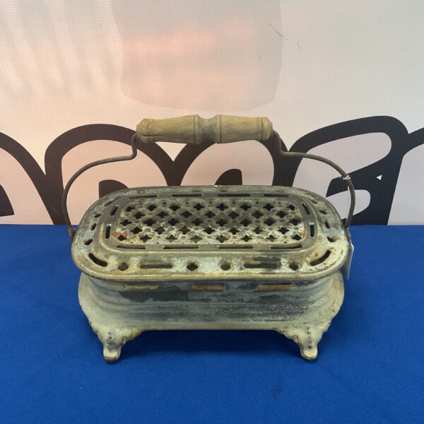 Antique French Godin & Cie cast iron foot warmer with pierced design.