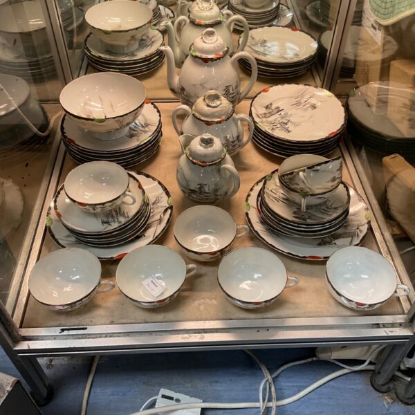 Antique Japanese porcelain tea set with grey landscape design.