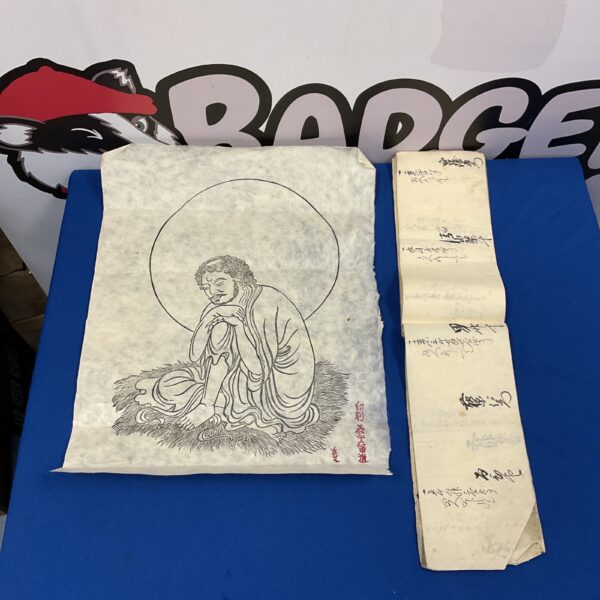Antique Japanese woodblock print with calligraphy book section.