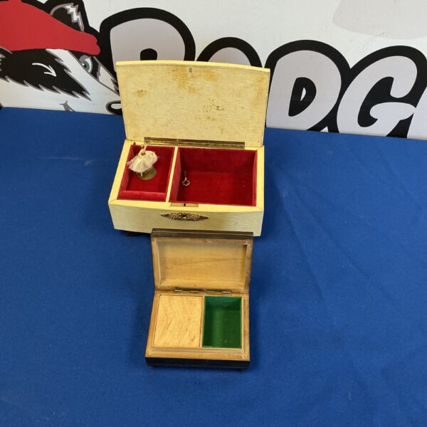 Antique musical jewellery box with inlaid wooden design.