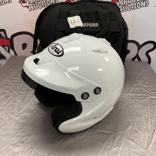 White Arai GP-J3 racing helmet with Oxford bag.