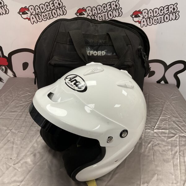 White Arai GP-J3 racing helmet with Oxford helmet bag.