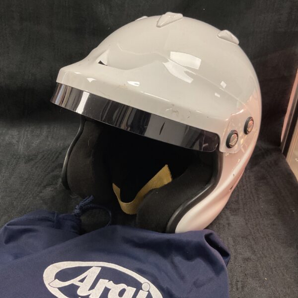 White Arai GP-J3 racing helmet with original bag.