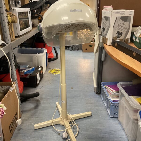 Vintage Babyliss hood hairdryer in a home setting.