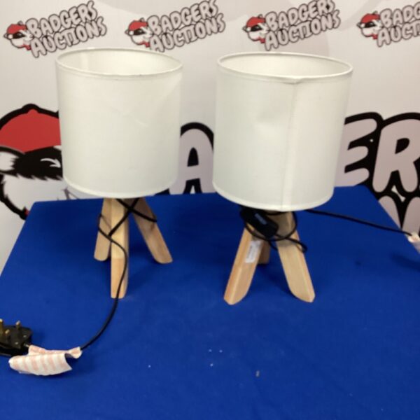 Pair of vintage bedside table lamps with wooden legs.