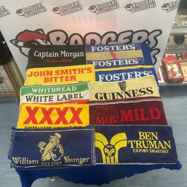 Assorted beer mats including Guinness, Captain Morgan and Fosters.
