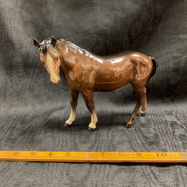 Vintage Beswick porcelain horse figurine model 976, a collectible equestrian art piece.