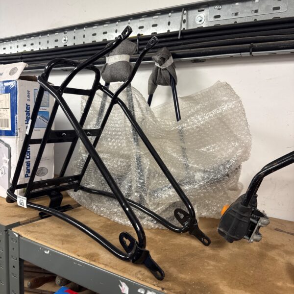 Steel bicycle luggage rack for panniers and cargo.