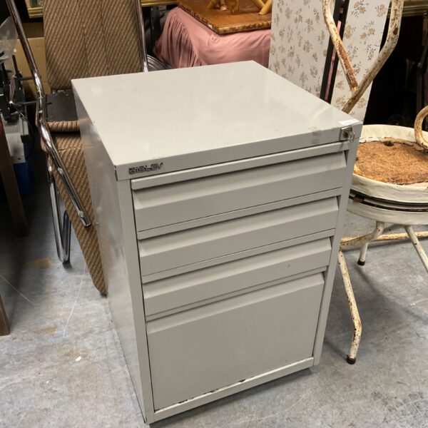 Vintage metal Bisley filing cabinet with multiple drawers for office storage.