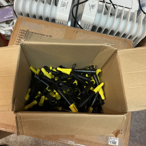 Close-up of Bissell adhesive tube end caps for vacuum cleaner repair.