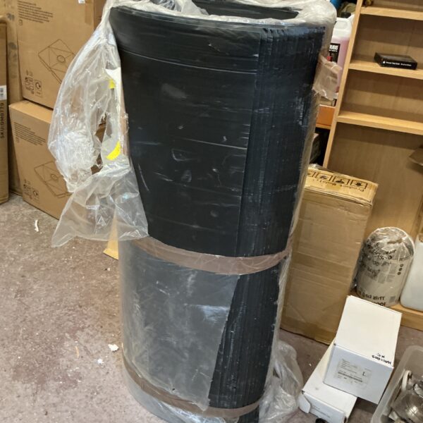 Rolled black membrane sheets for waterproofing and construction.