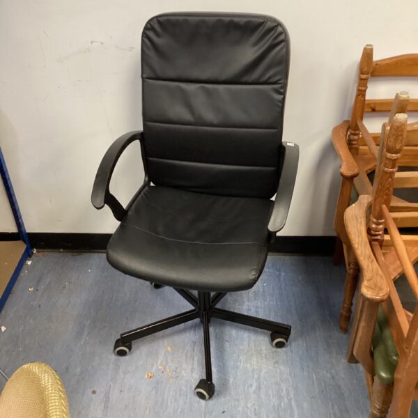 Black swivel office chair for desk work.