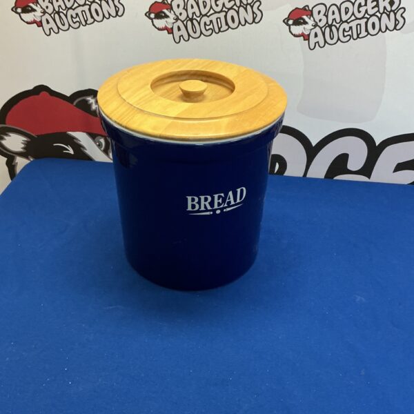 Blue ceramic bread bin for kitchen storage, vintage style.