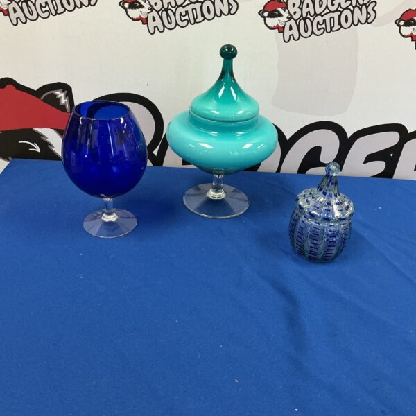 Vintage blue glass vase with flared rim.