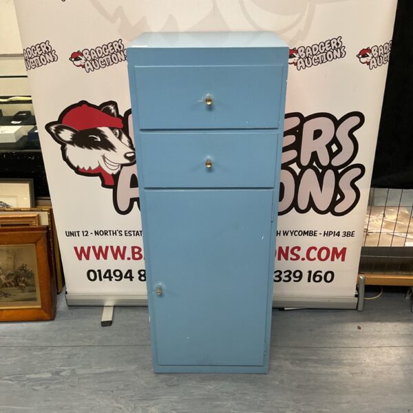 Vintage blue wooden storage unit with two drawers and a cupboard.