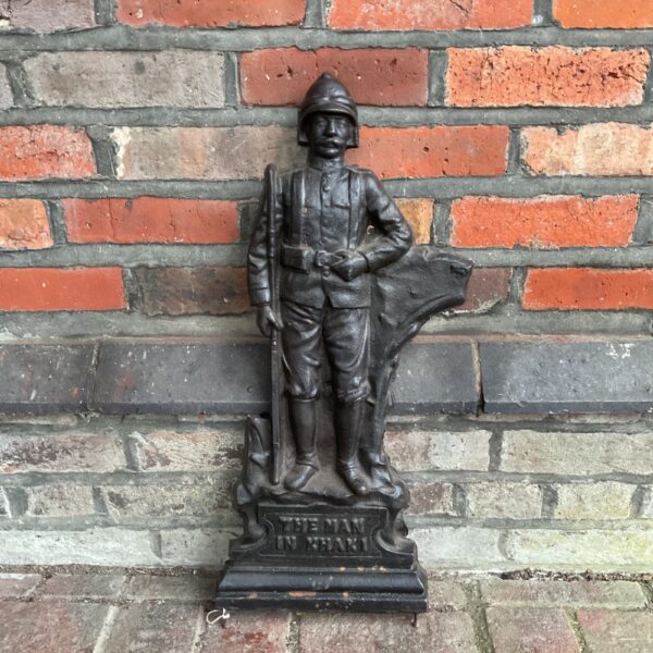 Antique cast iron Boer War soldier hall stand, detailed Victorian design.