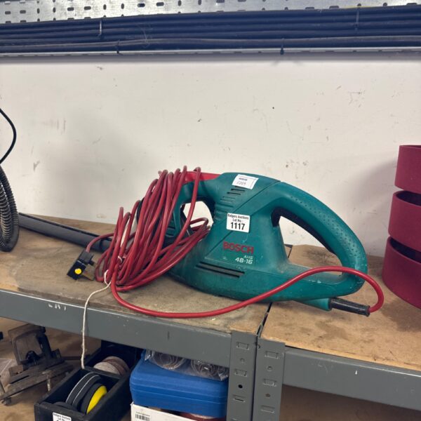 Used Bosch AHS 48-16 electric hedge cutter for garden trimming.