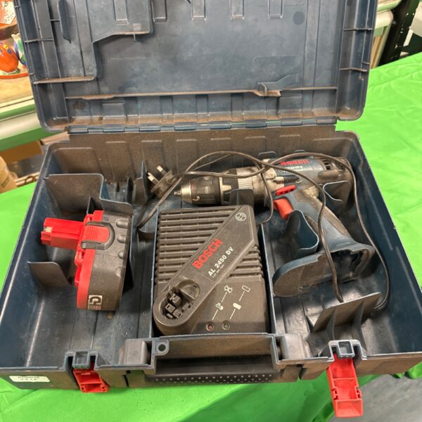 Open Bosch GSB 18 VE-2 cordless drill set with batteries and accessories.