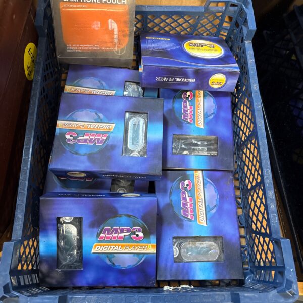 Boxed digital MP3 players, vintage portable music technology.