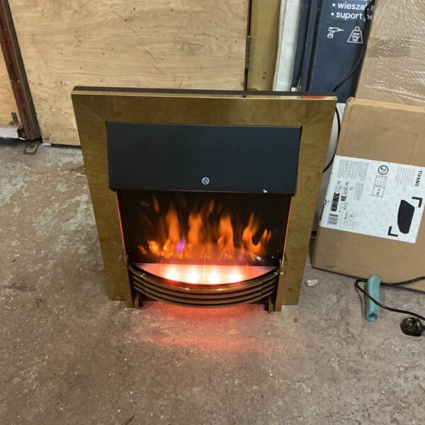 Vintage brass electric fireplace insert for home warmth.