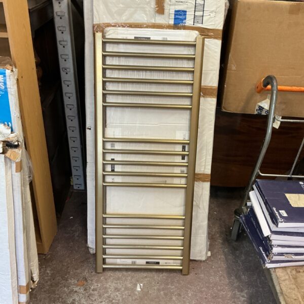 Brass coloured ladder radiator for central heating.