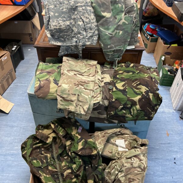 British Army camouflage clothing lot including jackets and trousers.