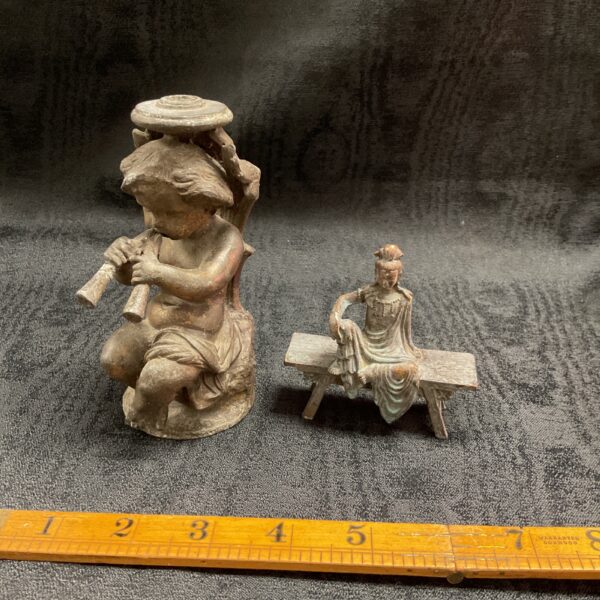 Antique bronzed spelter figures, cherub and Indian statue pair.