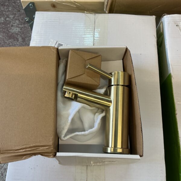 Brushed brass mixer tap with a modern design.