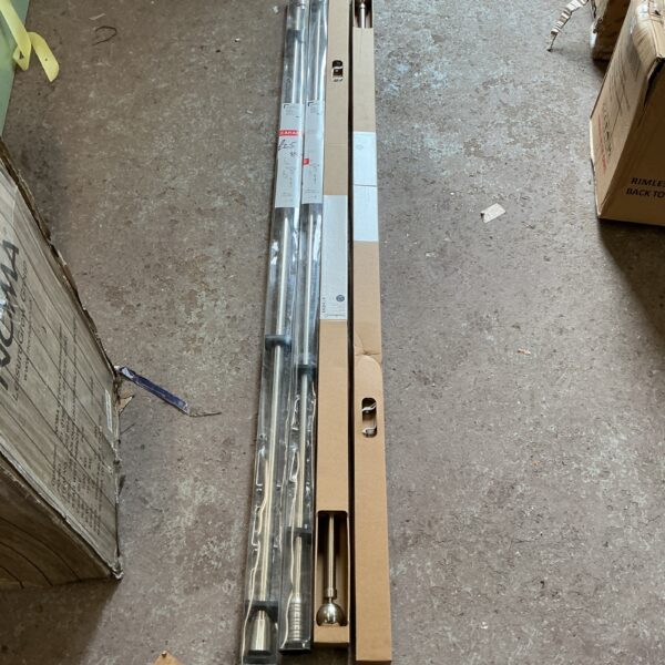 Four brushed steel extendable curtain poles for window treatments.