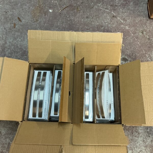 Two boxes of brushed steel handles for home improvement projects.