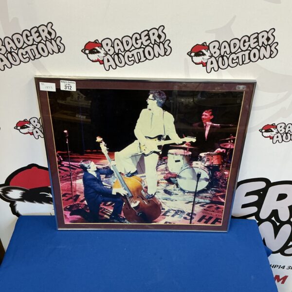 Framed vintage photograph of Buddy Holly, a rock and roll icon.