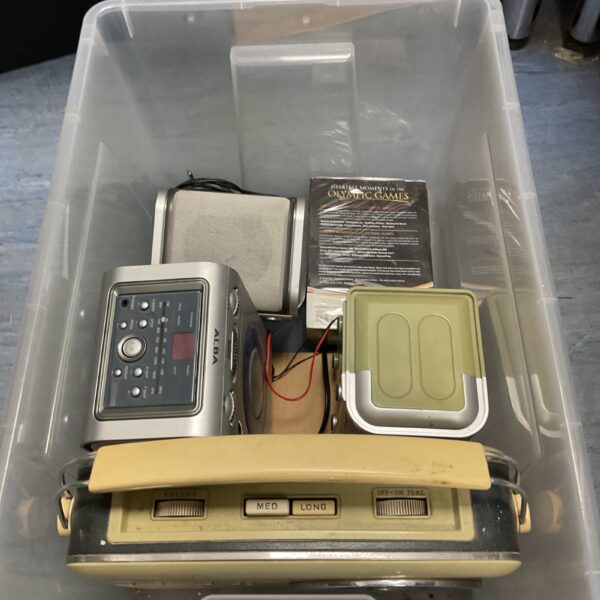 Vintage Bush TR82C transistor radio in a storage box.